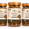 Three glass jars with orange lids containing Chandan sandalwood cone dhoop incense by Vedic Arpan on a white background