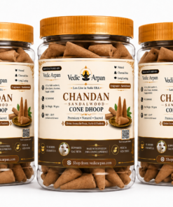 Three glass jars with orange lids containing Chandan sandalwood cone dhoop incense by Vedic Arpan on a white background